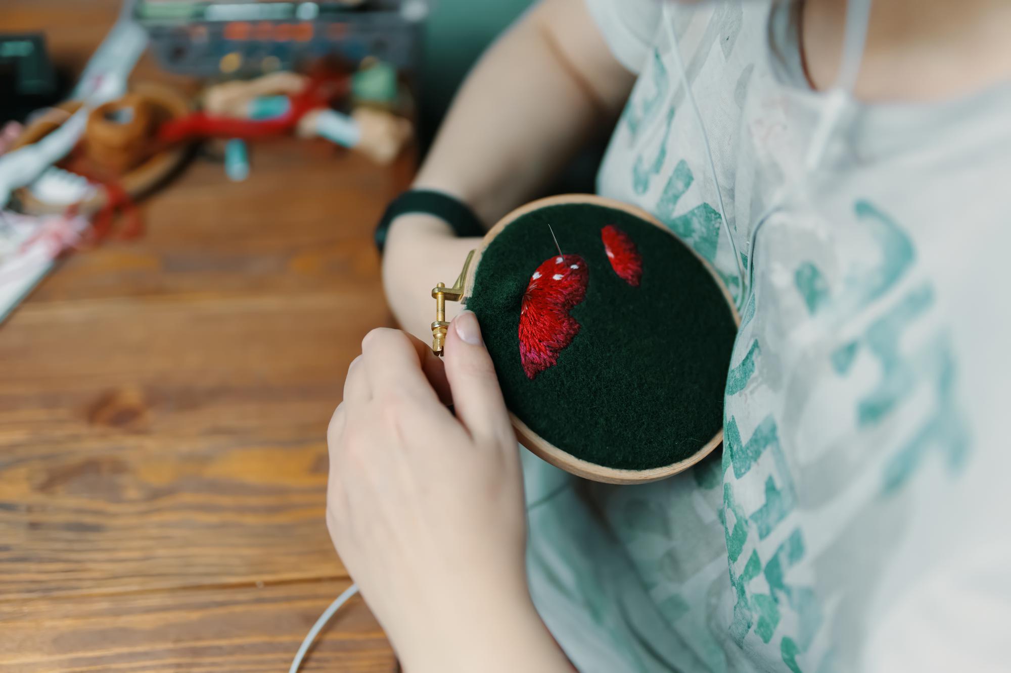 Craftsman hand embroidering detail