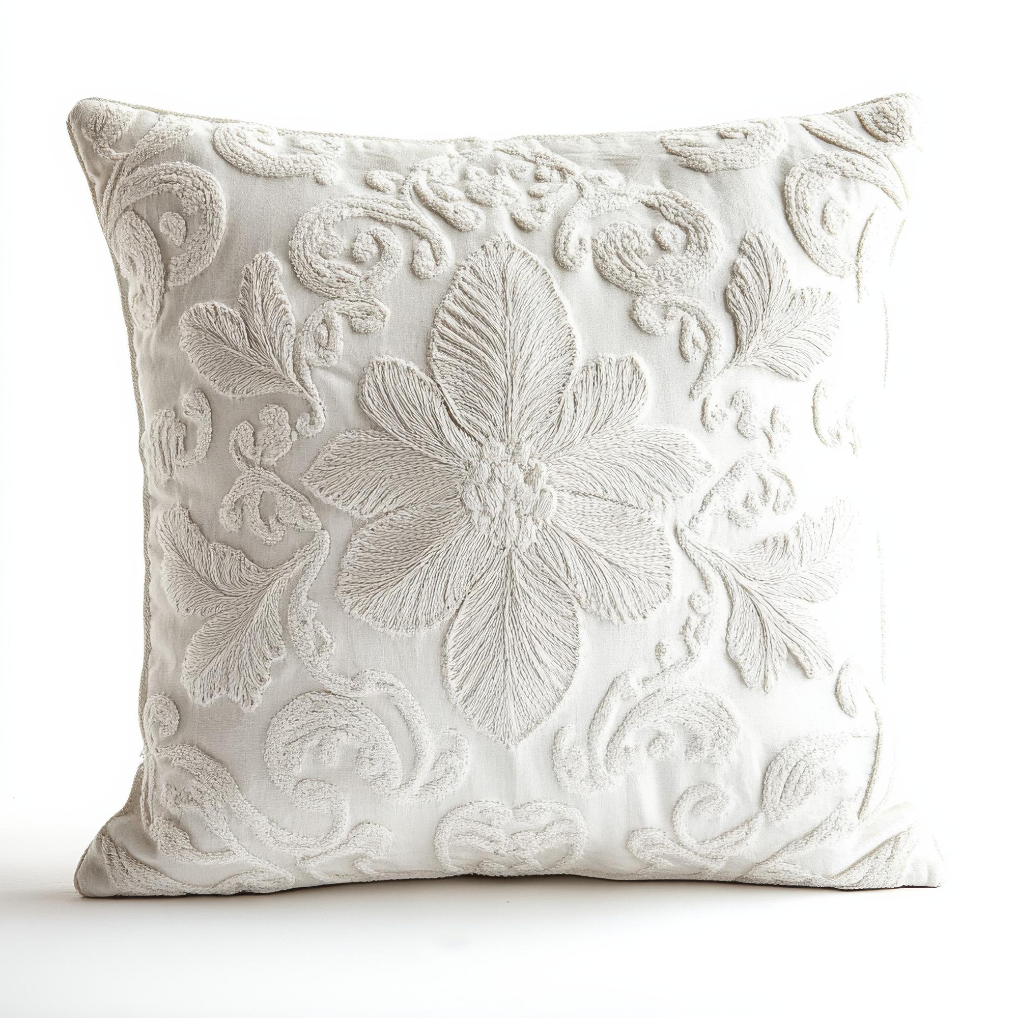 Large embroidered cushion in neutral tones