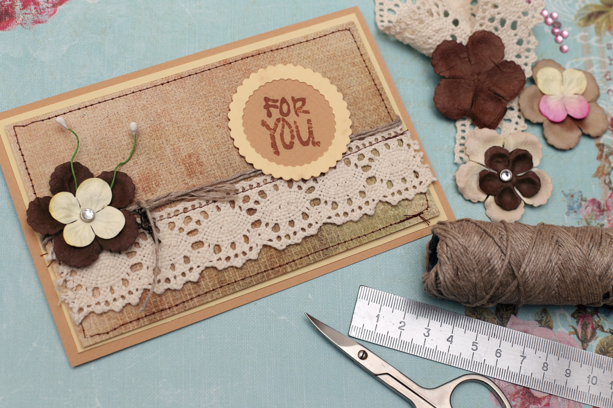 Set of embroidered patches on kraft paper